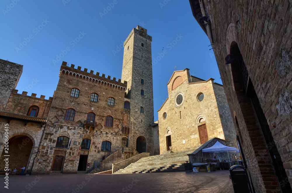 San Gimignano, Italy, Tuscany region. August 14 2016. The historic center of San Gimignano, a typical medieval village in Tuscany. Narrow streets, numerous stone towers characterize the urban landscap