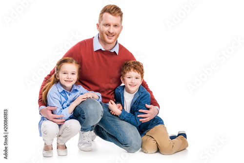 happy father with cute little kids smiling at camera isolated on white