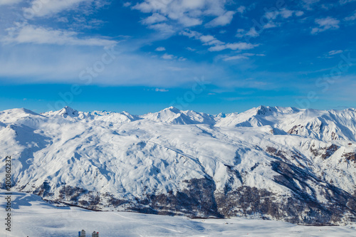 Picturesque view snowy mountain peaks panorama, Les Menuires ,Alps, France, ski slopes in 3 Valleys © umike_foto