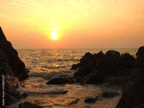 Sunset view over sea with stones