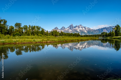 Mountains in Grand Teton National Park with reflection in Snake River