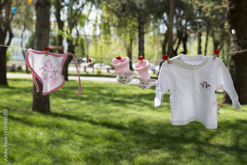 Baby Cloths Hanging On Rope in outdoor, in summer garden. Photo Taken On: April,2018.