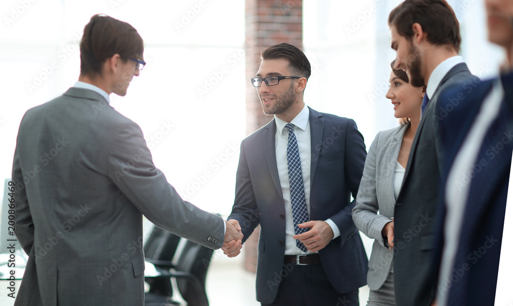 Confident young people, handshake and smile Confident young people, handshake and smile