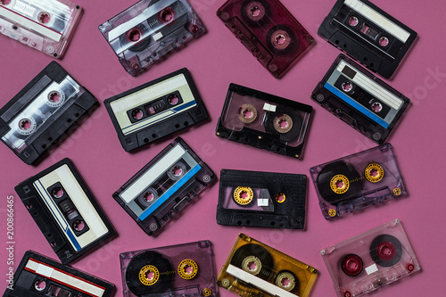 Vintage Audio Tapes On Lilac Background, Flat Lay View. Retro Technolody Music Concept