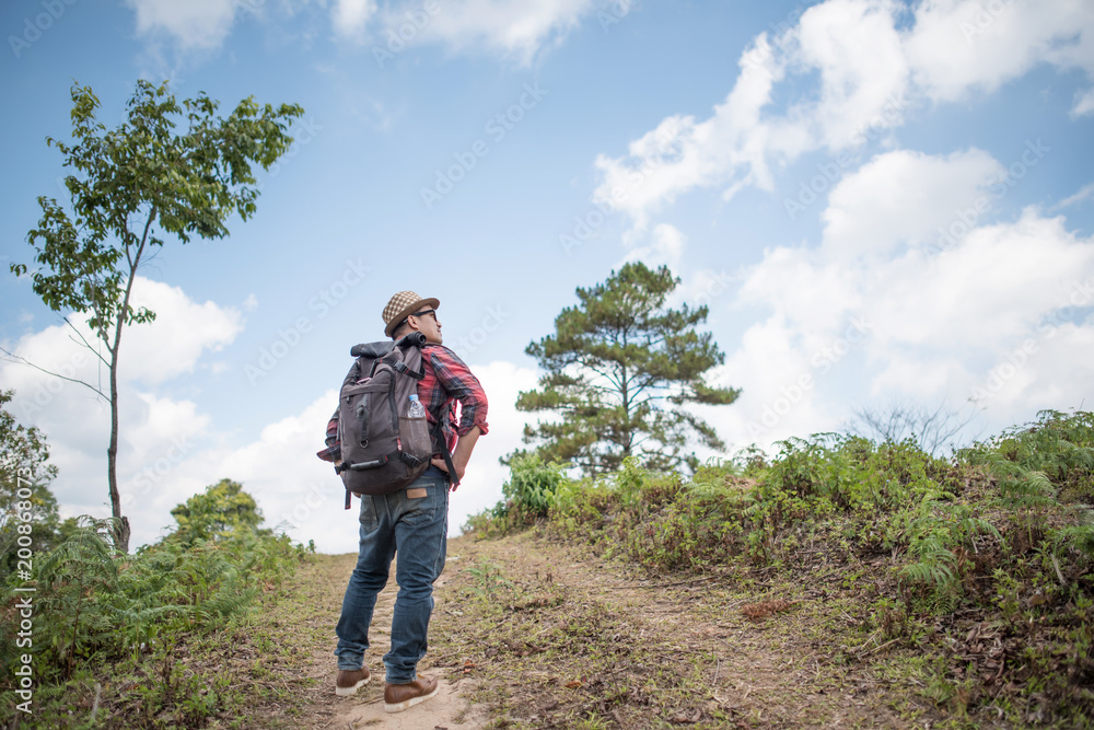 Young man Hiking in in the forest Young man Hiking in in the forest