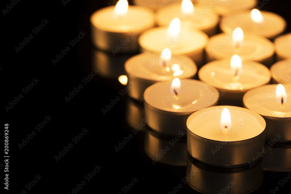 Little candles on a black background Little candles on a black background