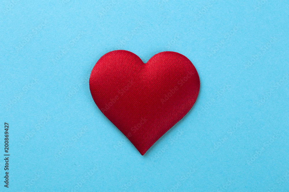 Decorative colourful sponge is small heart blue background