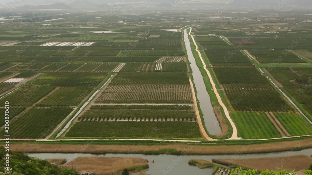 Top view of agricultural land. Valley of fields with irrigation system Top view of agricultural land. Valley of fields with irrigation system