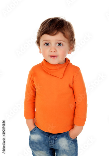 Canvastavla Beautiful little child two years old wearing jeans and orange jersey