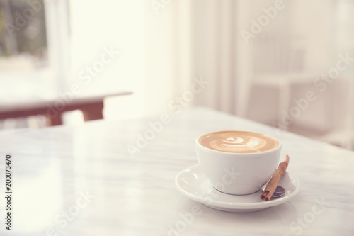 Cappuccino coffee cup on white marble table