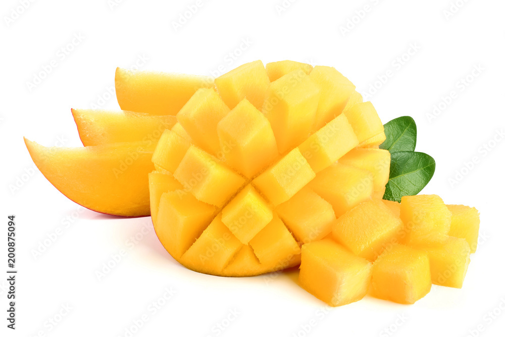 Mango fruit half with leaves and slices isolated on white background close-up Mango fruit half with leaves and slices isolated on white background close-up