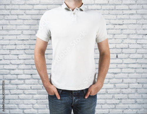 Man wearing blank shirt on brick background