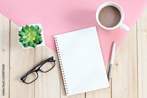 Still life, business, office supplies, planning or education concept : Top view or flat lay of open notebook with blank pages and coffee cup on office table with copy space ready for adding or mock up