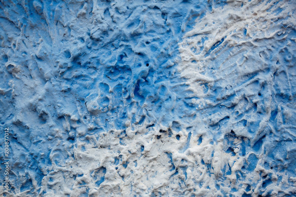 Blue and white decorative plaster on the wall like a sky. Art background Blue and white decorative plaster on the wall like a sky. Art background