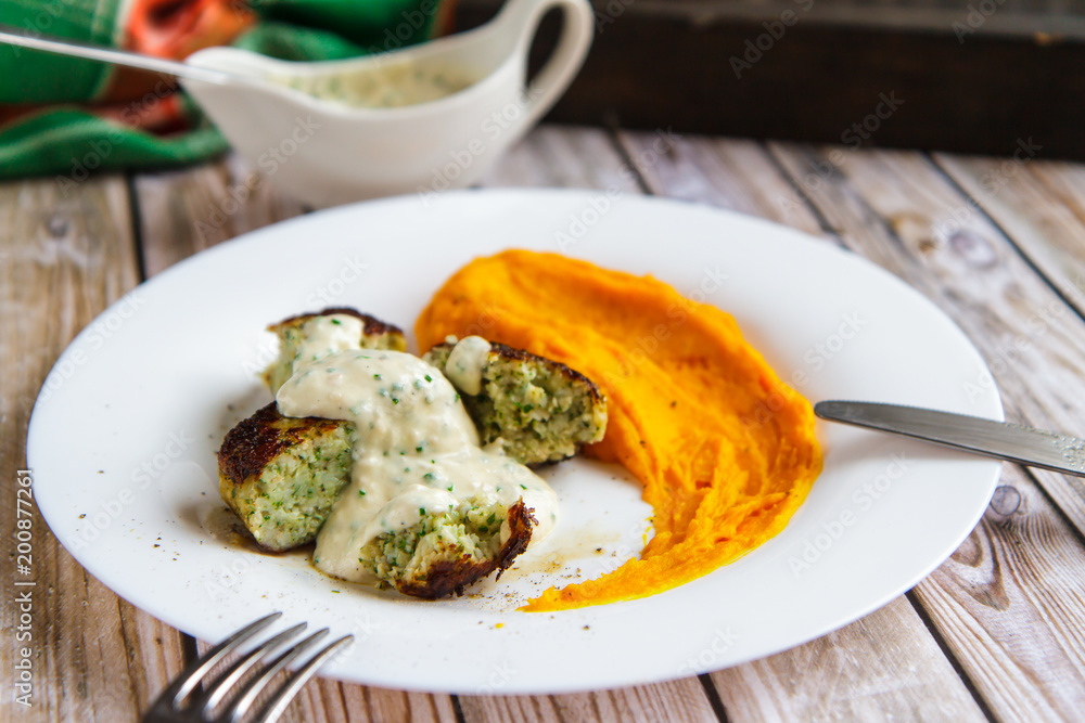 Fish cutlets with pumpkin puree and sauce