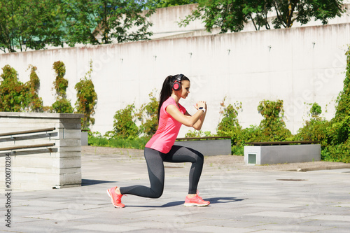 Young and sporty woman training outdoor