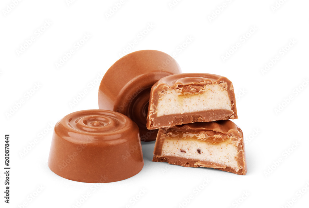Chocolate candies in a cut on a white background Chocolate candies in a cut on a white background