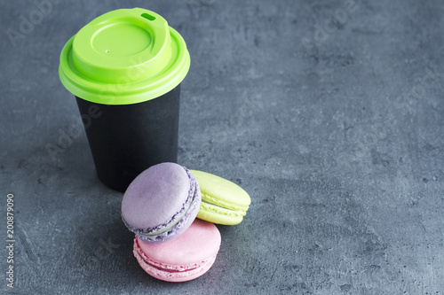 Coffee with macarons on the table photo