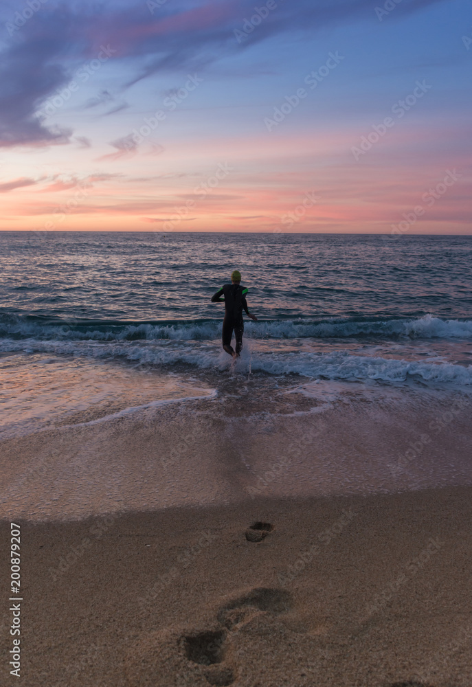 Triathlete training for the ironman at sea. Triathlete training for the ironman at sea.