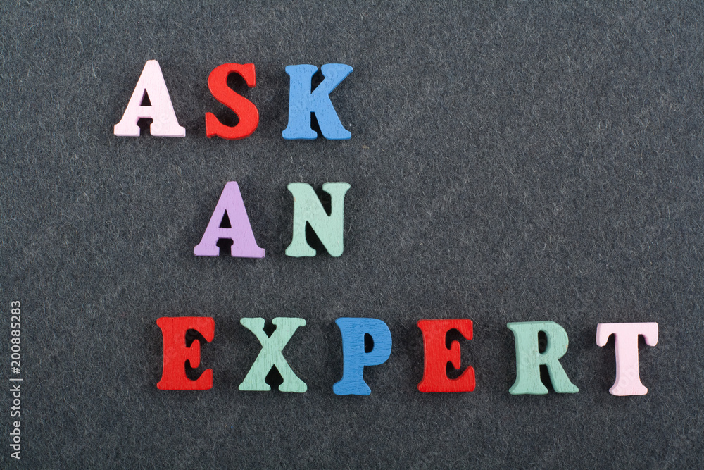 ASK AN EXPERT word on black board background composed from colorful abc alphabet block wooden letters, copy space for ad text. Learning english concept. ASK AN EXPERT word on black board background composed from colorful abc alphabet block wooden letters, copy space for ad text. Learning english concept.