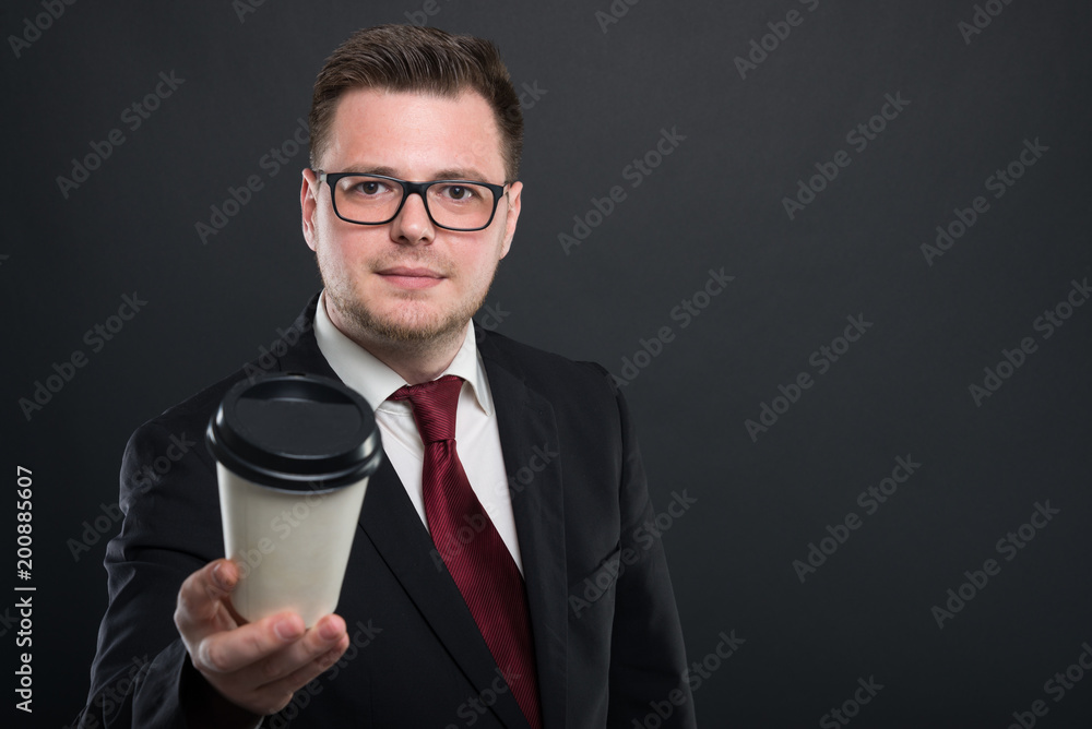 Portrait of business man offering cup of takeaway coffee. Portrait of business man offering cup of takeaway coffee.