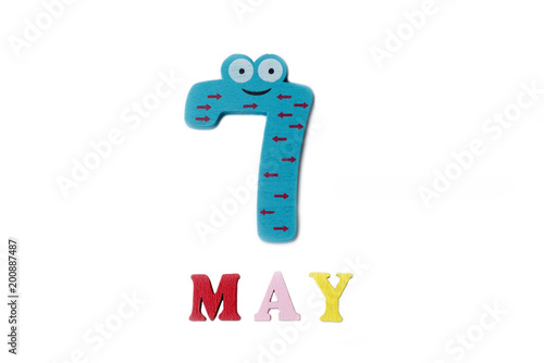 The number seven and the word may on a white background. photo