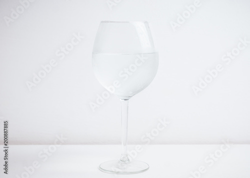 Cold water in glass on the rustic background. Selective focus.