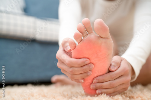 Quadro su tela foot ankle injury pain women touch her foot painful, healthcare and medicine con