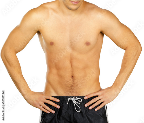 Topless young man bodybuilder posing isolated on white background