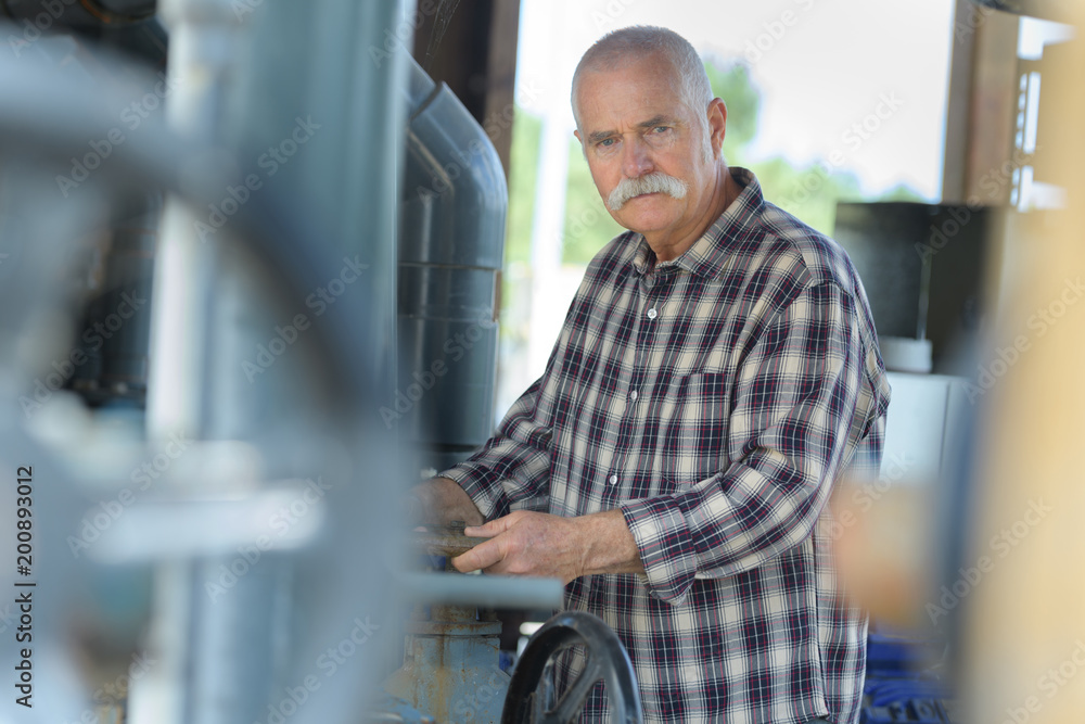 mechanical engineer working on fuel pipeline in plant mechanical engineer working on fuel pipeline in plant