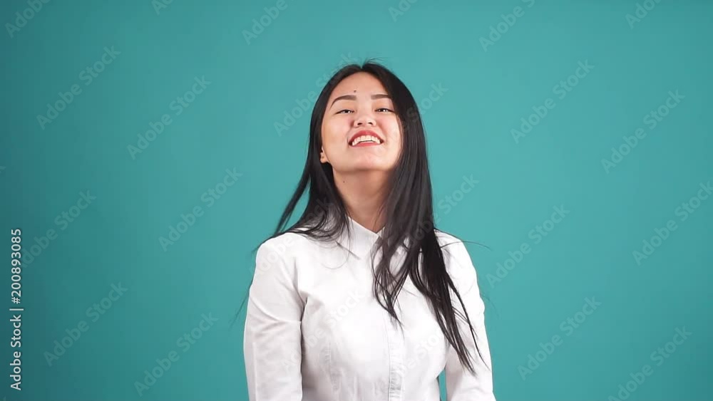 Young Happy Asian Pretty Woman Looking Camera Isolated. Young Happy Asian Pretty Woman Looking Camera Isolated.