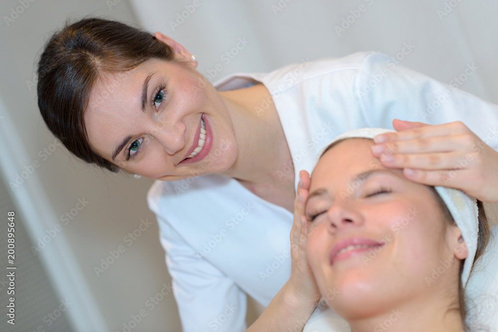 beautiful young girl having face massage in spa salon beautiful young girl having face massage in spa salon