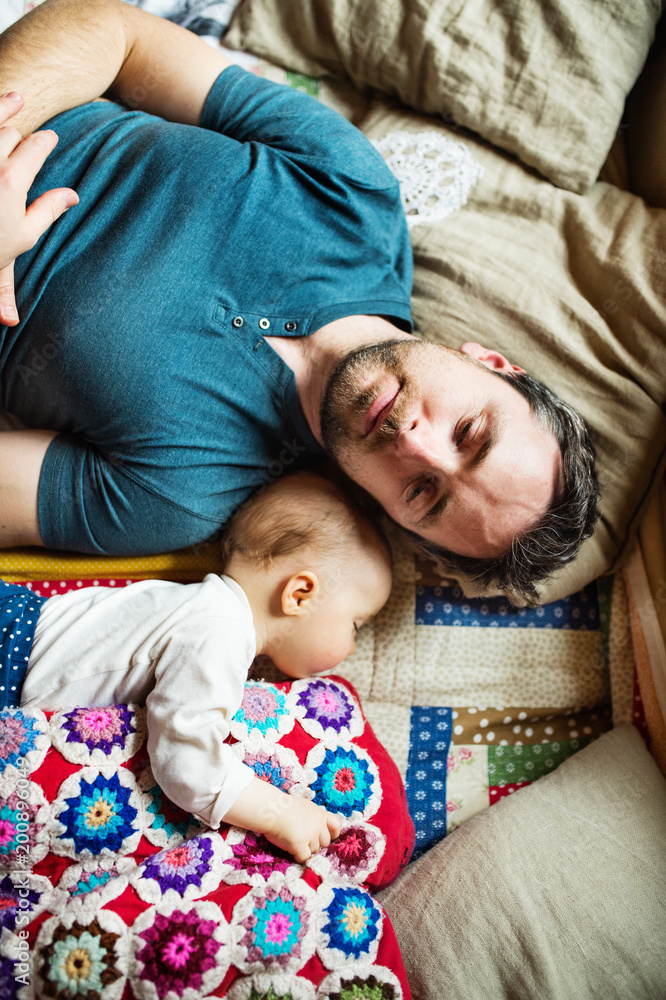 Father with a baby girl at home sleeping. Father with a baby girl at home sleeping.
