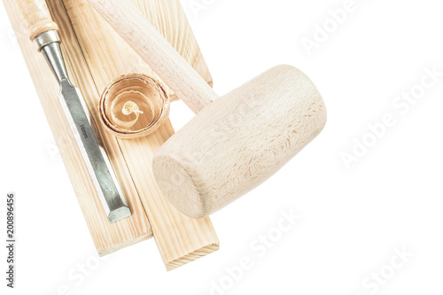 Wooden mallet bricks flat chisel shavings isolated on white