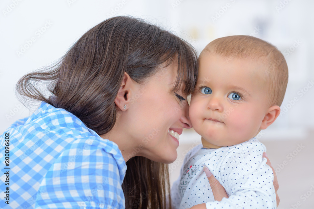 mothing snuggling up to her baby girl