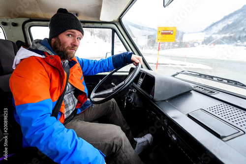 Interior view of delivery man driving a van or truck.