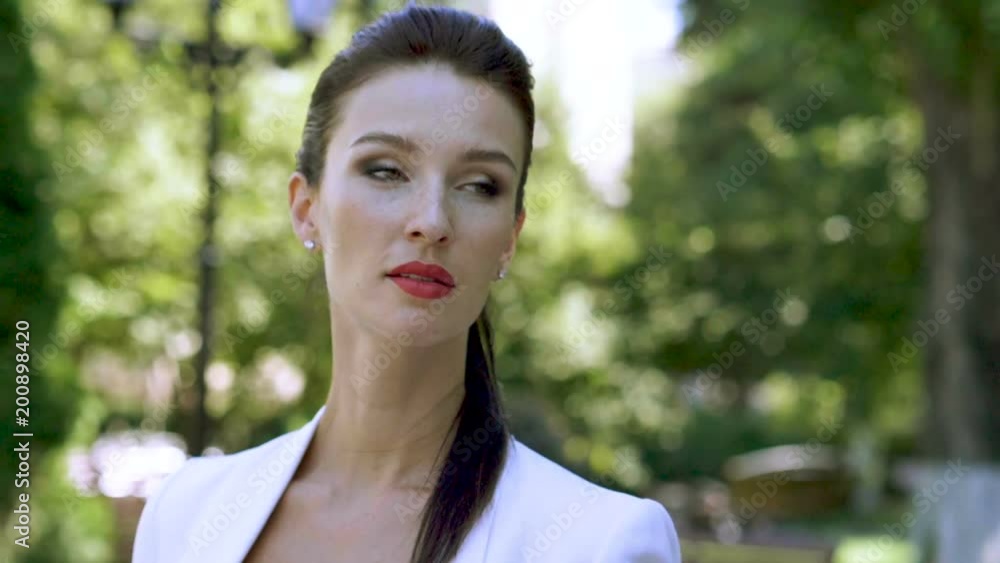 Portrait of pretty brunette young woman with passionate red lips. Slow motion HD Portrait of pretty brunette young woman with passionate red lips. Slow motion HD