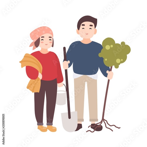 Pair of cute happy smiling man and woman farmers or gardeners carrying seedli...