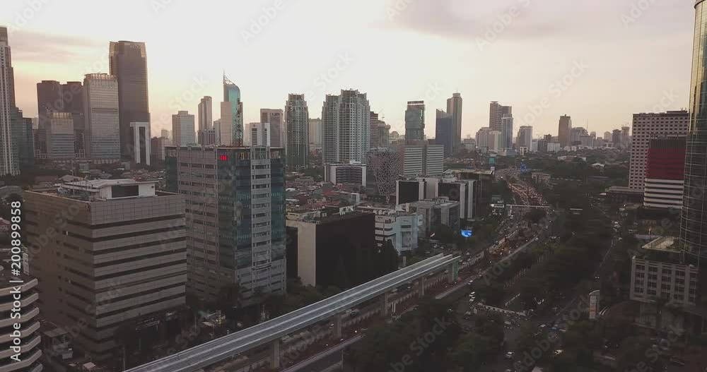 JAKARTA - Indonesia. April 11, 2018: Beautiful aerial landscape of Jakarta downtown with office buildings background and construction of Light Rail Transit tracks. Shot in 4k resolution JAKARTA - Indonesia. April 11, 2018: Beautiful aerial landscape of Jakarta downtown with office buildings background and construction of Light Rail Transit tracks. Shot in 4k resolution