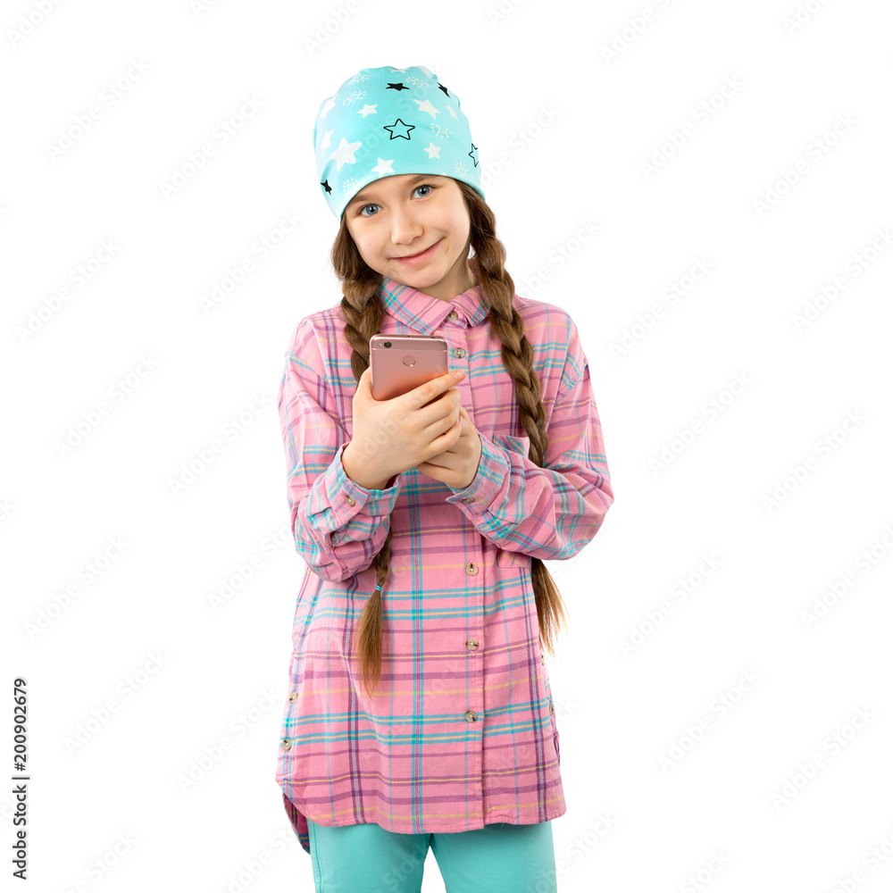 A sweet girl holds a smart phone in her hands and smiles. Isolated on a white background. A sweet girl holds a smart phone in her hands and smiles. Isolated on a white background.