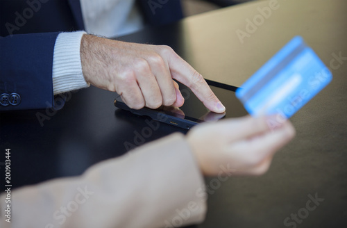 Young couple using tablet and credit card for online shopping