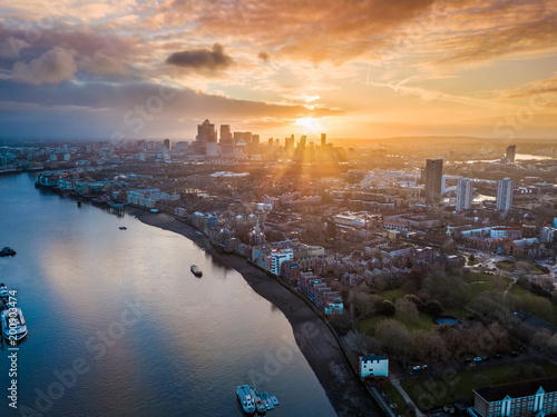 Tablou canvas London, England - Panoramic aerial skyline view of east London at sunrise with s