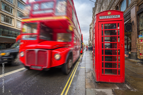 Photography London, England - Iconic blurred black londoner taxi and vintage red double-deck