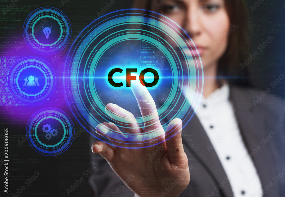 The concept of business, technology, the Internet and the network. A young entrepreneur working on a virtual screen of the future and sees the inscription: CFO The concept of business, technology, the Internet and the network. A young entrepreneur working on a virtual screen of the future and sees the inscription: CFO