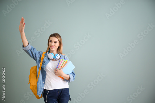 Pretty student with noteboo...