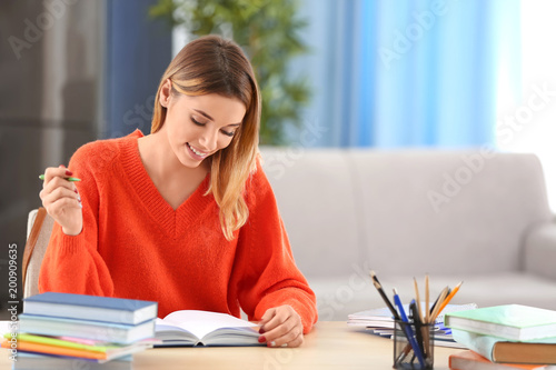Pretty student studying at ...