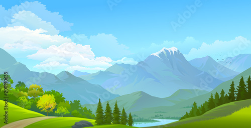 Landscape view of snow covered mountains, green meadows and a river