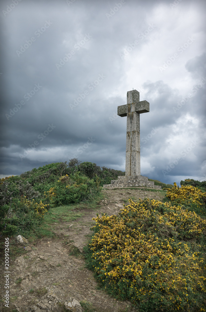 Dodman point cross and yellow gorse flower Cornwall Dodman point cross and yellow gorse flower Cornwall