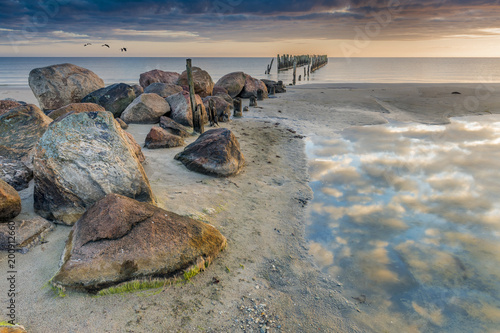 Coastal landscape with remains of old marine pier that was used for tradition...