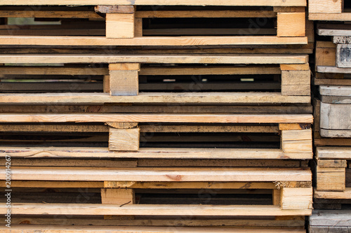 Stacks of Wooden pallets for industrial transportation by trucks